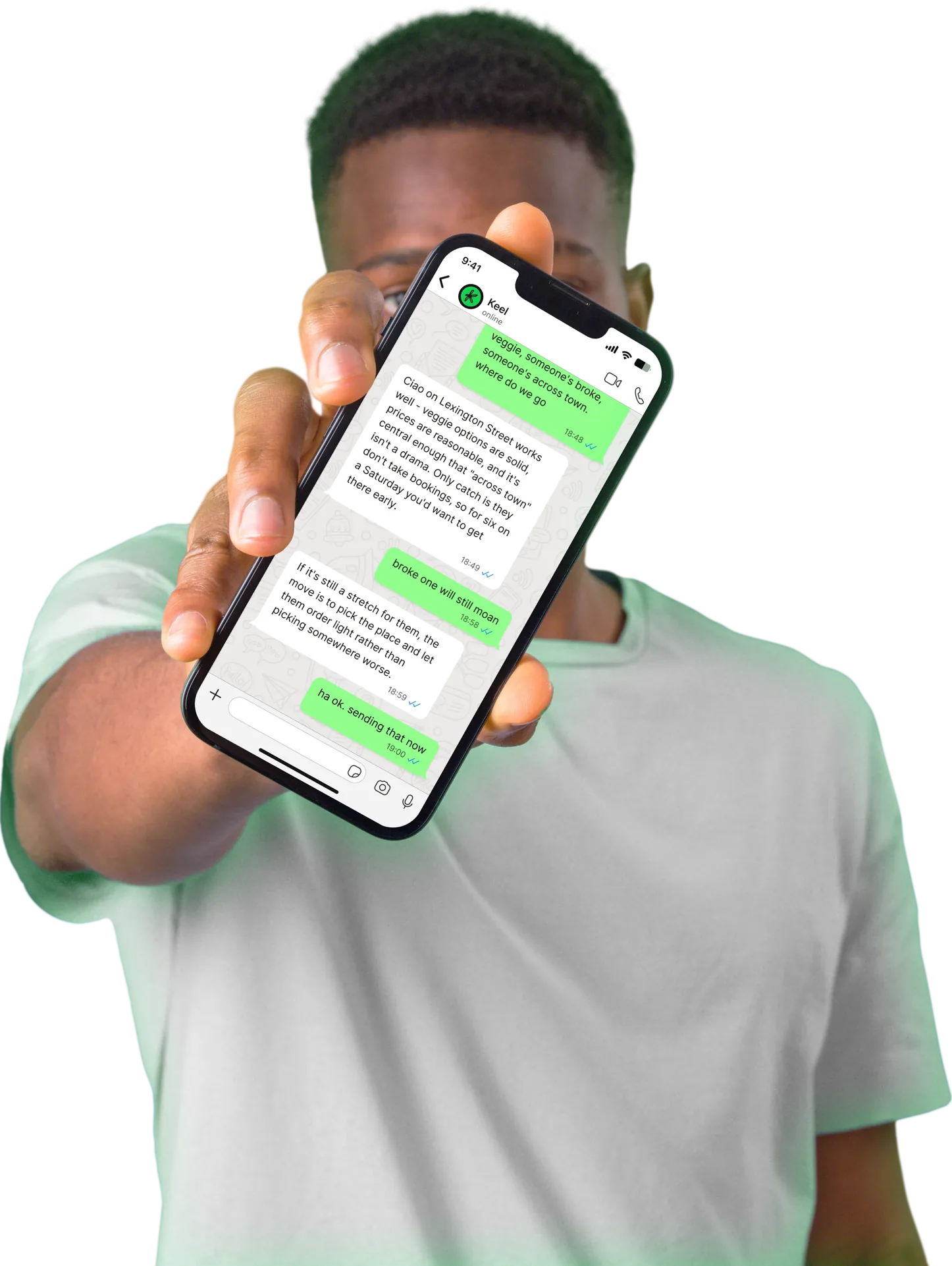 A person holding a phone showing a chat with Keel